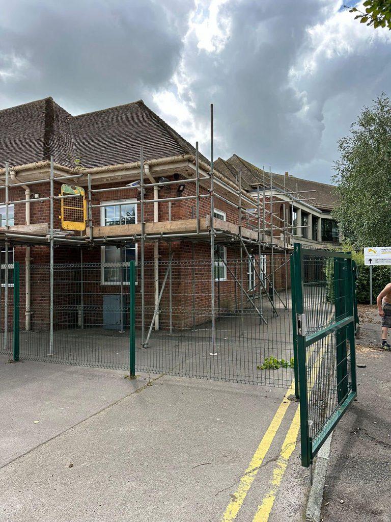 Erecting scaffold at a school